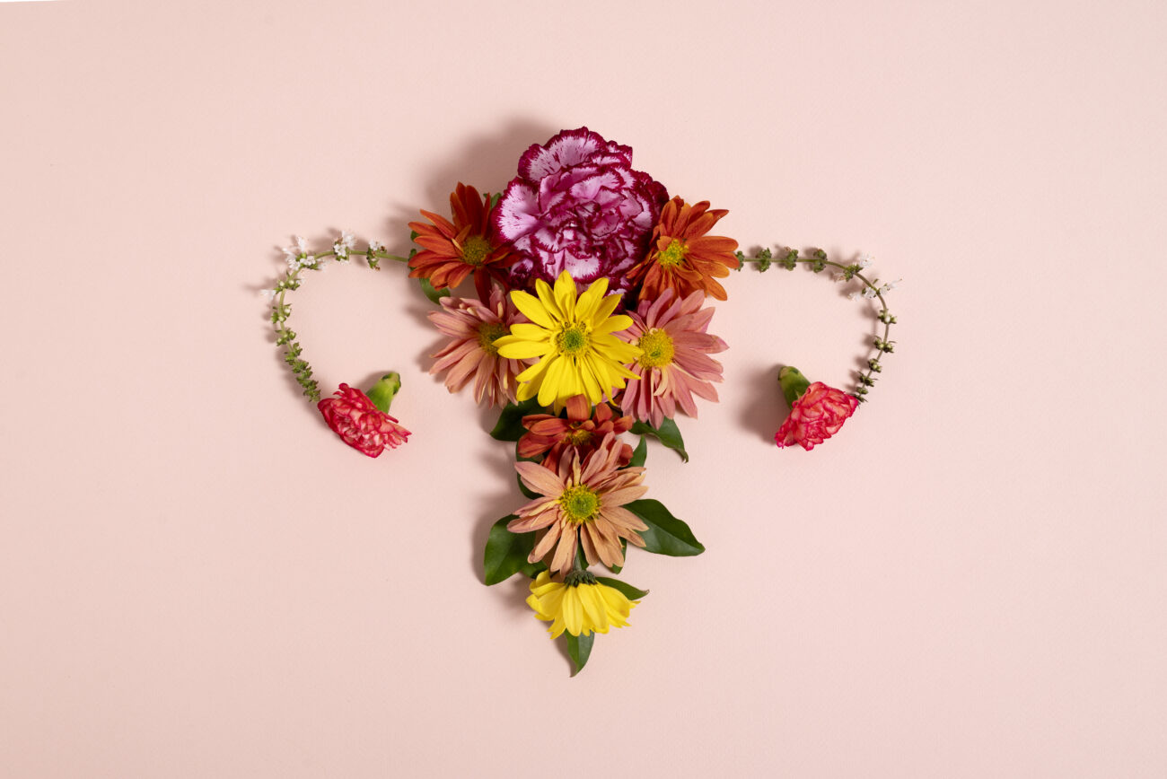 decorative image of a femal reproductive organ using flowers